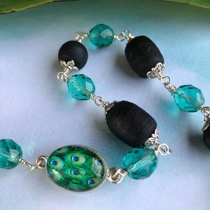 38  1/2" black Tulasi with peacock and teal crystal glass beads
